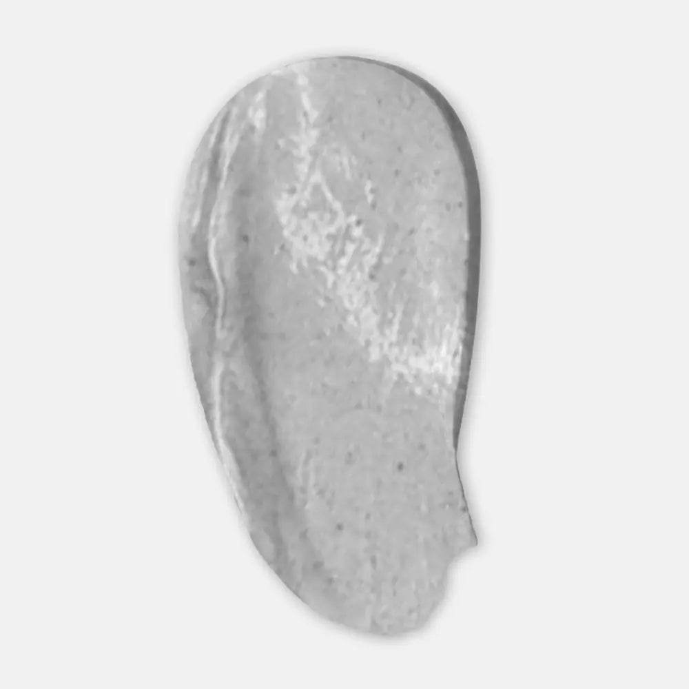 Gray smear of cream or paint on a light gray background