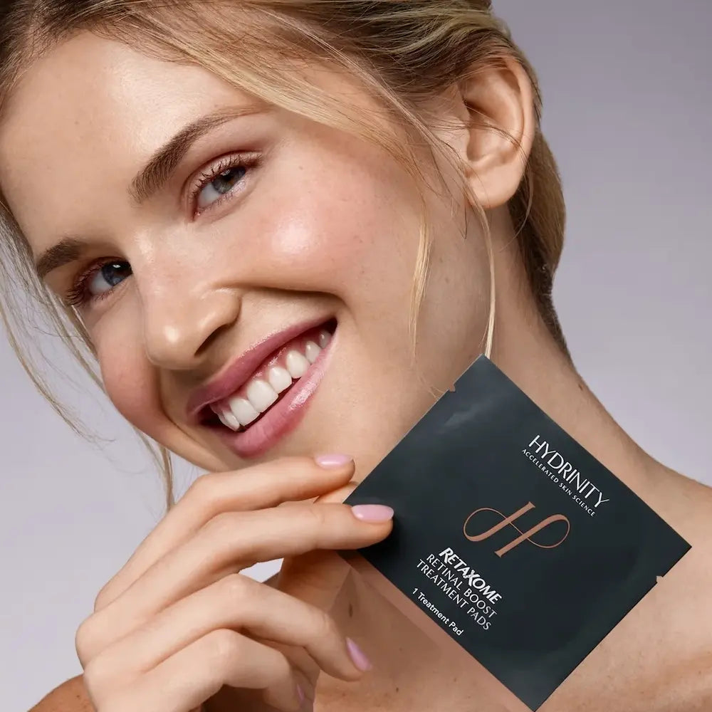 Beautiful woman with Hydrinity RetaXome Retinal Boost Treatment Pads