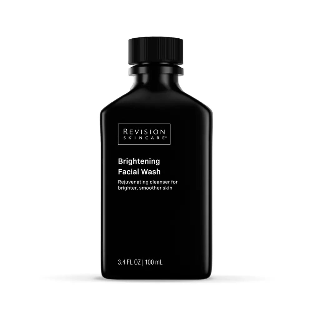 Black bottle of Revision Skincare Brightening Facial Wash travel size on a white background