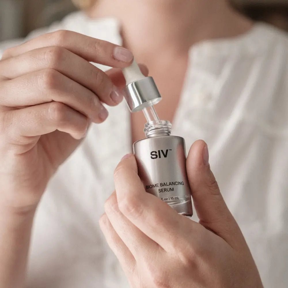 Person holding a dropper bottle of SIV serum