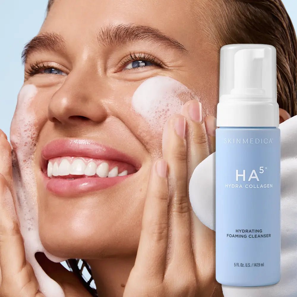Blue bottle of HA5 Hydra Collagen Hydrating Foaming Cleanser with model using it