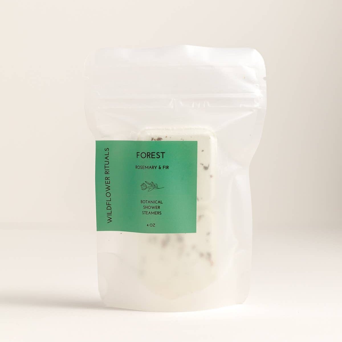 White packaging with a green label on a beige background