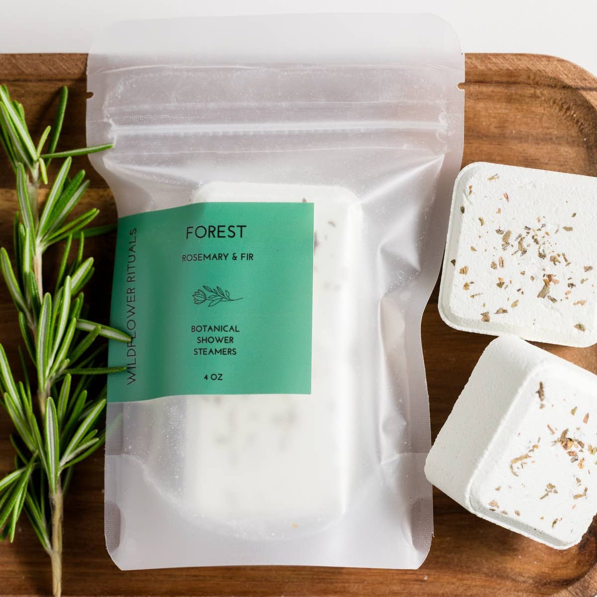 Packaged product with a green label on a wooden tray with herbs