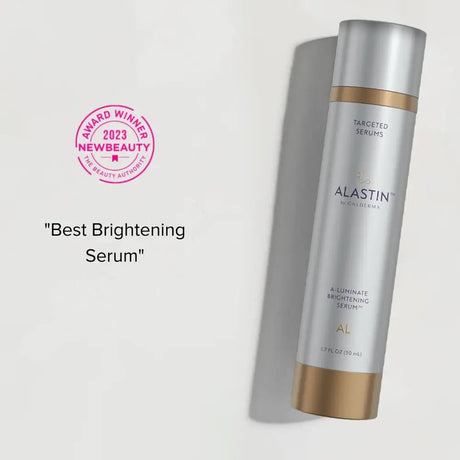 Alastin A-Luminate serum bottle with 'Best Brightening Serum' text and award badge on a light gray background