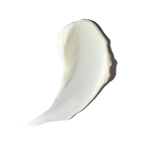 A thick, creamy white Alastin Ultra Calm Cleansing Cream smear, likely a lotion or cream, shown on a solid white background with a soft shadow.