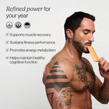 Man holding a Cymbiotika Advanced Creatine supplement pouch with text about its benefits on a white background