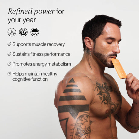 Man holding a Cymbiotika Advanced Creatine supplement pouch with text about its benefits on a white background