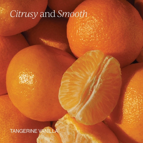 Close-up of tangerines with a sliced tangerine on top, labeled 'Citrusy and Smooth Tangerine Vanilla'.