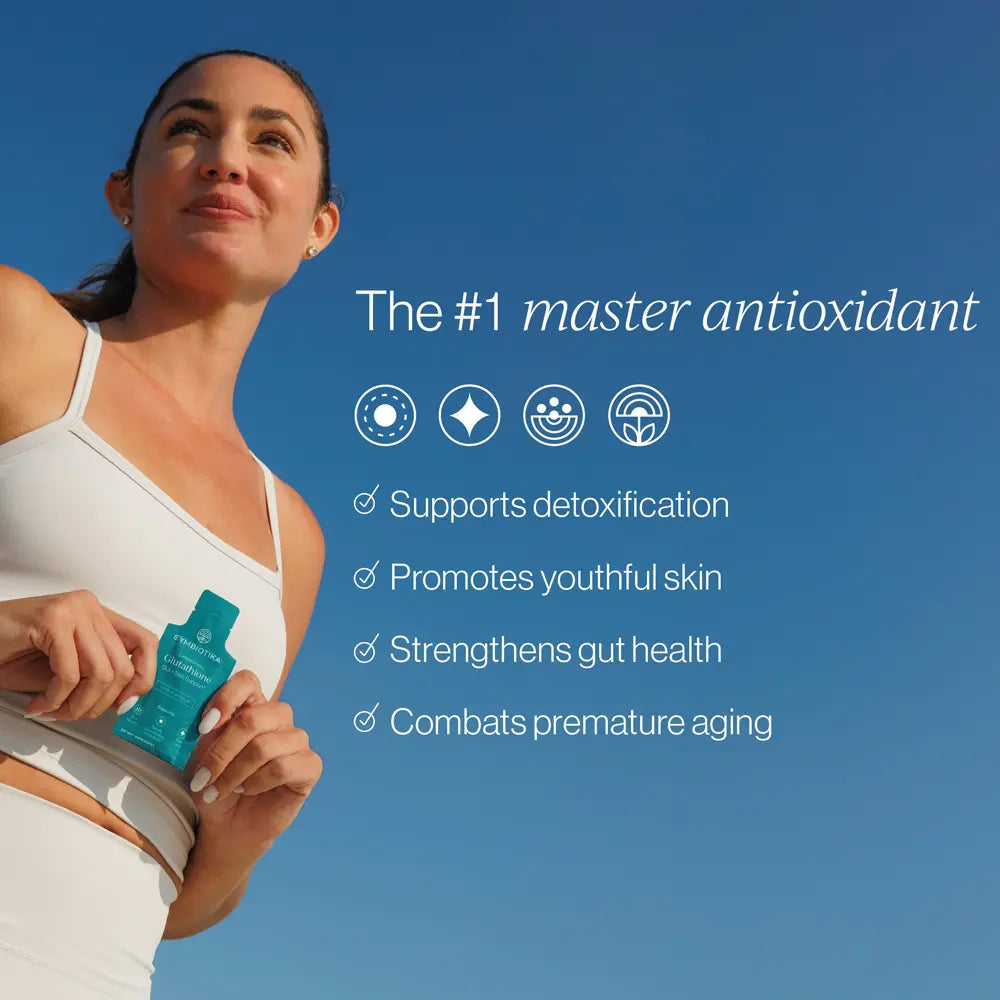 A woman in a white sports bra and leggings holds a teal bottle outdoors against a clear blue sky, with marketing text on the right reading 'The #1 master antioxidant' and bullet points about detoxification, youthful skin, gut health, and aging.