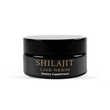 A black jar of Cymbiotika Shilajit Live Resin dietary supplement with gold and white lettering, set against a plain white background.