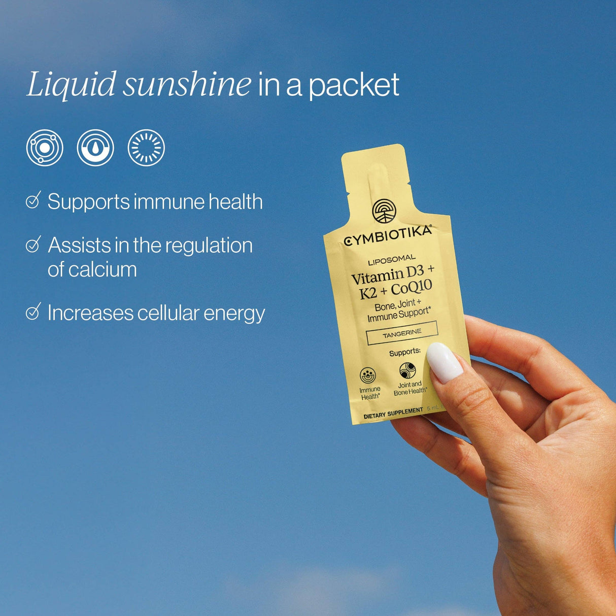 Cymybiotika supplement packet held by a hand against a blue sky background