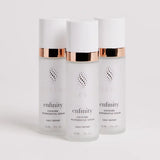 Three bottles of Elevai Enfinity Exosome Regenerative Serum on a white background