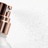 Fine mist spraying from the rose gold nozzle of Elevai HOCl Allantoin Active Cleanser Spray