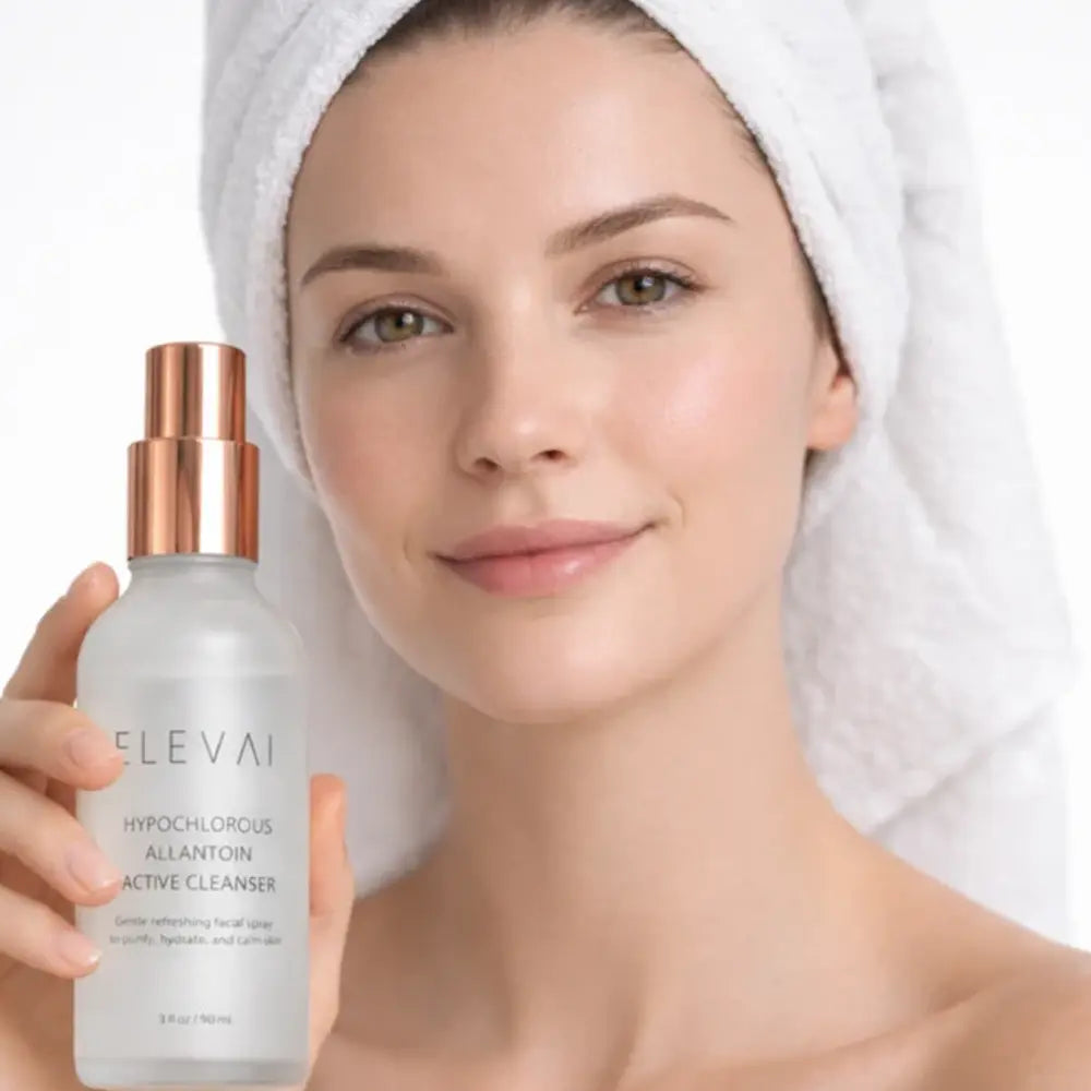 Woman in a hair towel holding Elevai HOCl Allantoin Active Cleanser Spray after cleansing