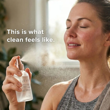 Woman misting her face with Elevai HOCl Allantoin Active Cleanser Spray for clean, refreshed skin