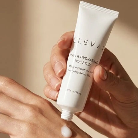 Elevai Hyper Hydrating Booster milky moisturizer squeezed onto the back of a hand to show its lightweight texture