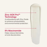 A texture of EltaMD UV Clear Blemish-Prone and Oil Balancing SPF 50 n on a light beige background with text callouts reading 'Zinc-AOX Pro™ Technology' and '5% Niacinamide'.