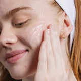 Close-up of Face Reality Active Clarity Gel Cleanser being massaged into the cheek