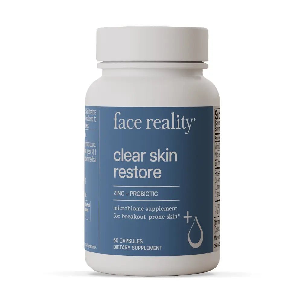 Supplement bottle labeled 'face reality clear skin restore' on a white background