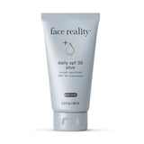 Tube of 'face reality' daily SPF 30 plus sunscreen on a white background