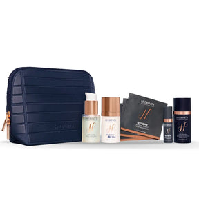 Hydrinity Wrapped in Radiance Set with navy cosmetic bag, PRELUDE cleanser, HYACYN Active, RetaXome pads, RetaXome hydrator and CÉLTHERA cream