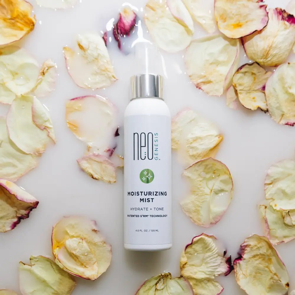 Moisturizing mist bottle on a bed of dried apple slices