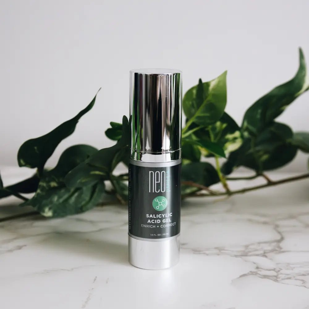 Neogenesis Salicylic Acid Gel Bottle in a marbled room - Your Skincare Source
