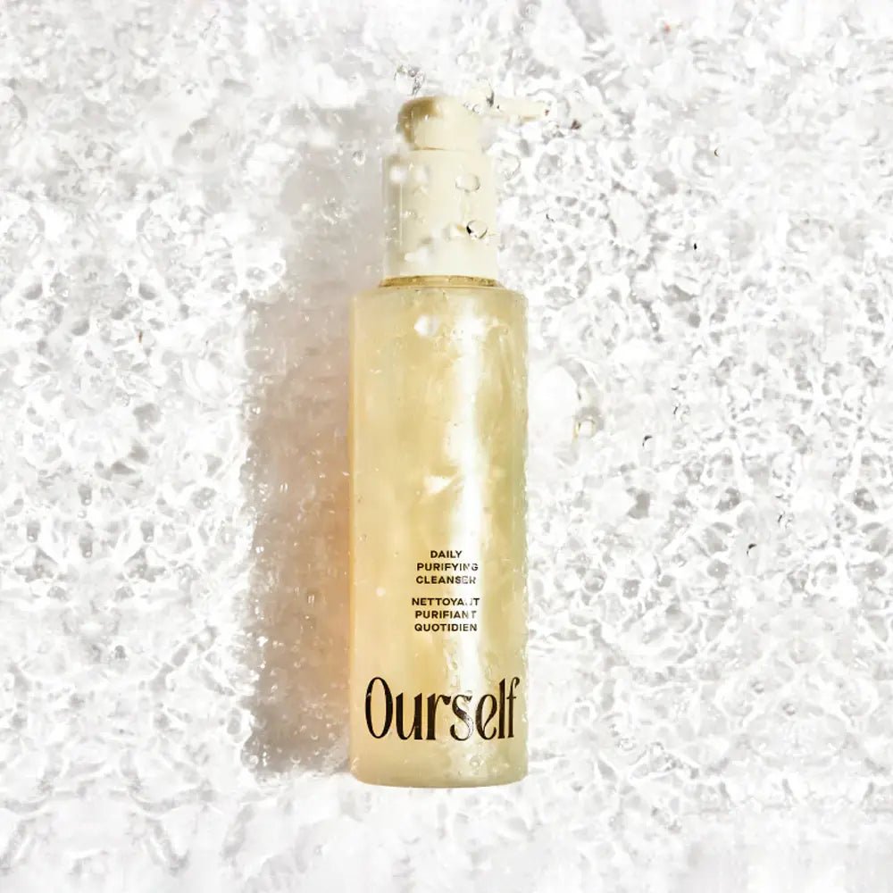 Skincare bottle labeled 'Ourself' on a textured white background