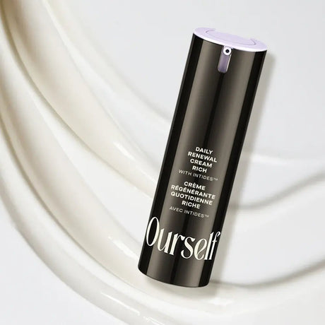 Black skincare bottle labeled 'Ourself Daily Renewal Cream Rich' on a white background