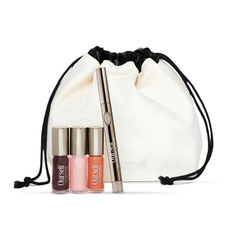 Set of Ourself lip products including lipsticks and a lip liner with a clear drawstring bag on a white background.