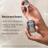 Hand holding a bottle of plated hair serum with application instructions.