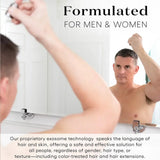 Man washing hair with a bottle labeled 'Formulated for Men & Women' in a bathroom setting.