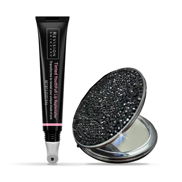Revision skincare tube with a decorative compact mirror on a white background