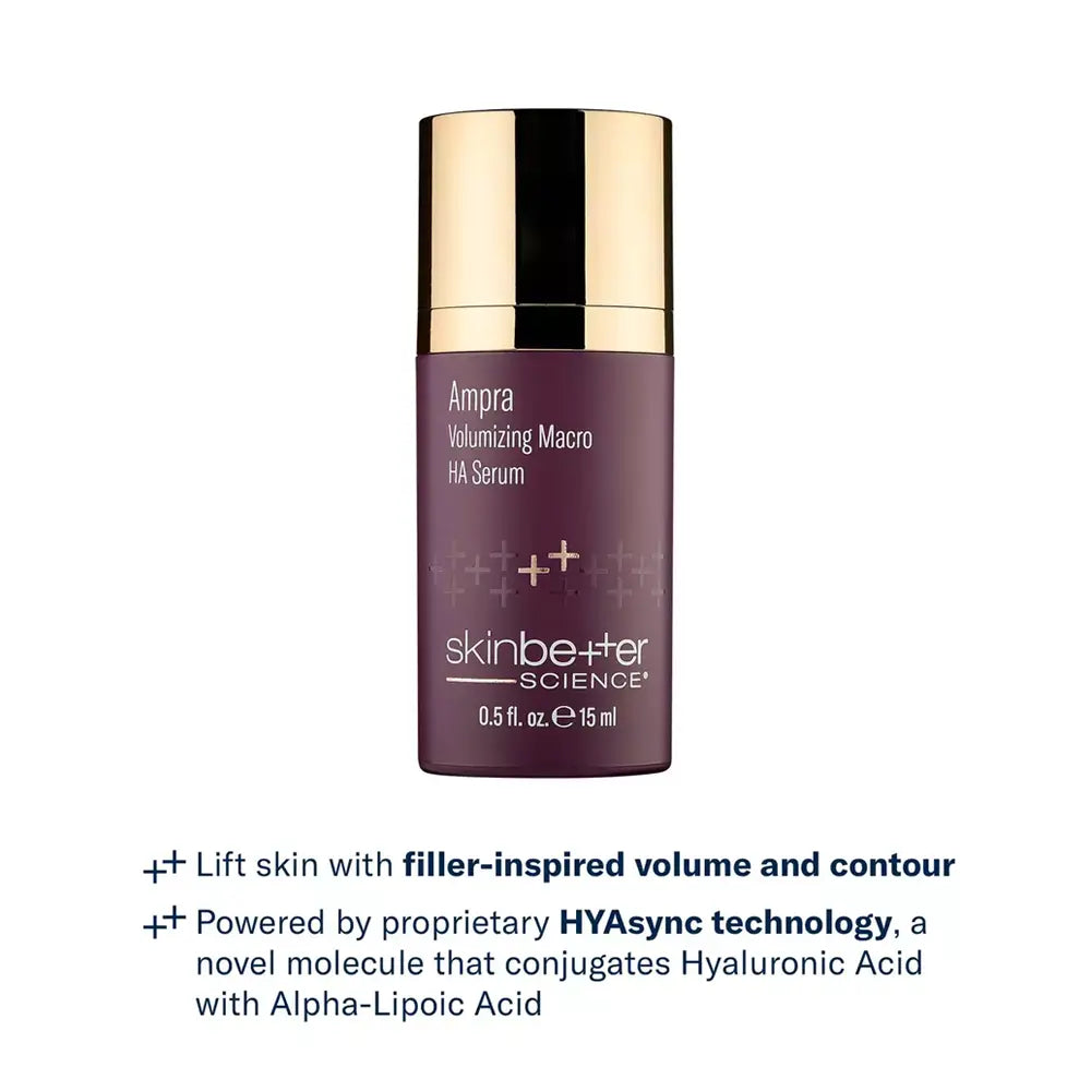 A bottle of skinbetter Ampra Volumizing Macro HA Serum with a metallic gold cap and a deep plum-purple bottle, shown on a white background, with the product benefits below.