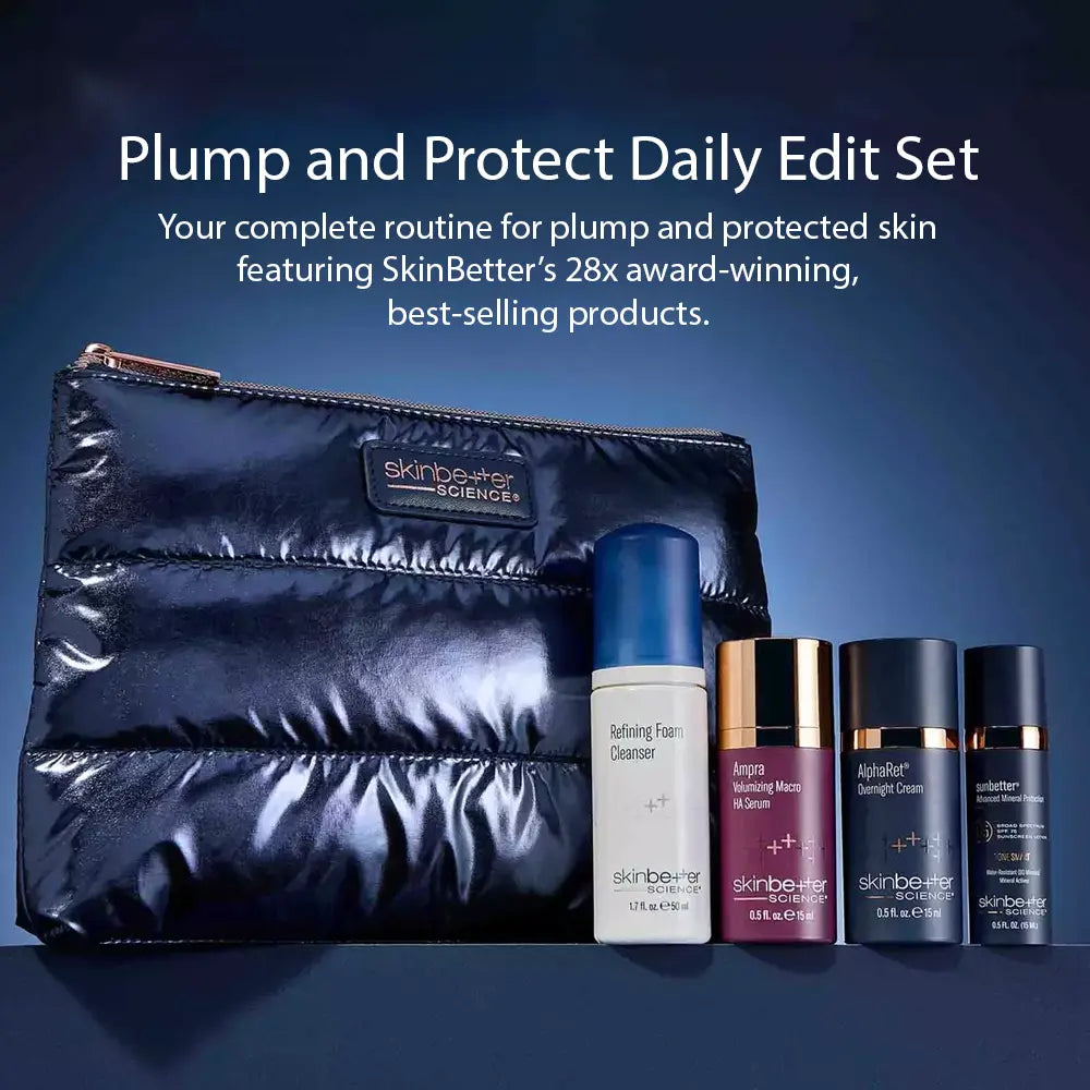 SkinBetter Plump and Protect Daily Edit Set featuring a shiny navy blue puffer pouch and four skincare bottles (Refining Foam Cleanser, Ampere Morning Mist, AlphaBeta Sunscreen Cream, and The Skincare Rescue Balm) on a dark blue gradient background with promotional text.