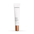 A white squeeze tube of SkinMedica Even and Correct Dark Spot Cream with a metallic rose gold cap, centered on a clean white background.