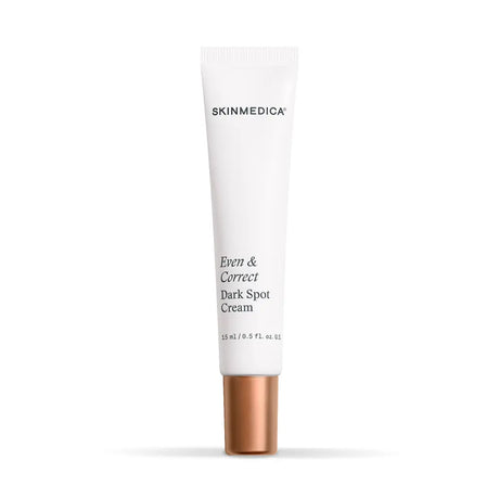 A white squeeze tube of SkinMedica Even and Correct Dark Spot Cream with a metallic rose gold cap, centered on a clean white background.