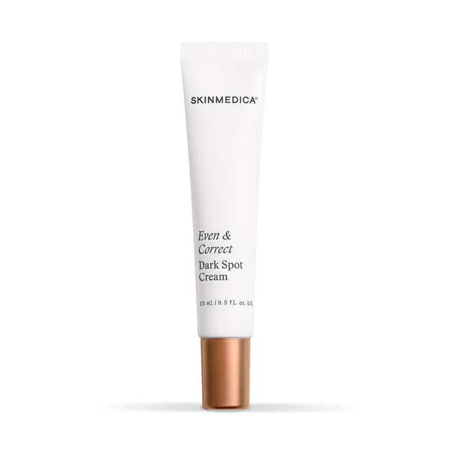 A white squeeze tube of SkinMedica Even and Correct Dark Spot Cream with a metallic rose gold cap, centered on a clean white background.