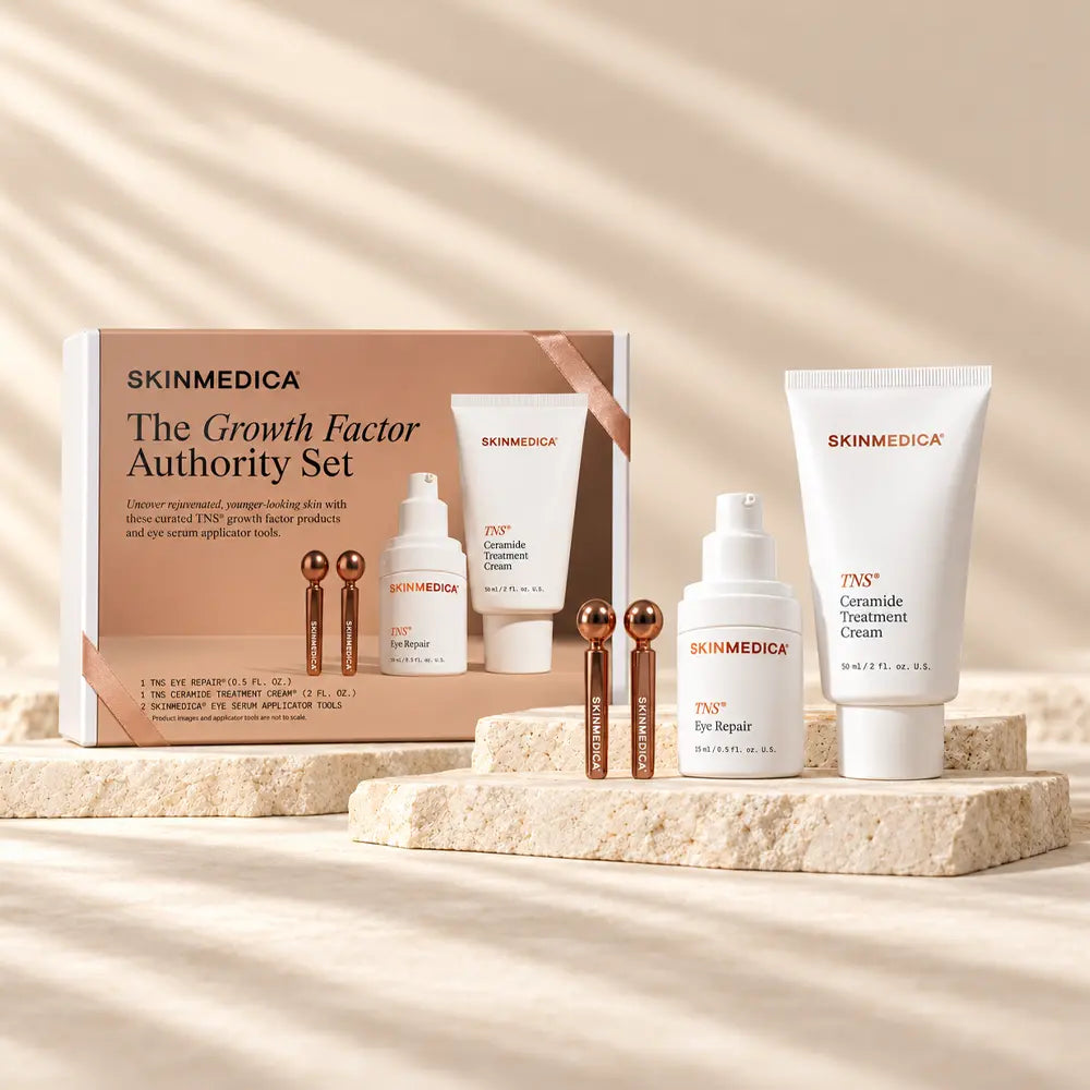 SkinMedica Growth Factor Authority Set gift box displayed with TNS Eye Repair, TNS Ceramide Treatment Cream and applicator tools
