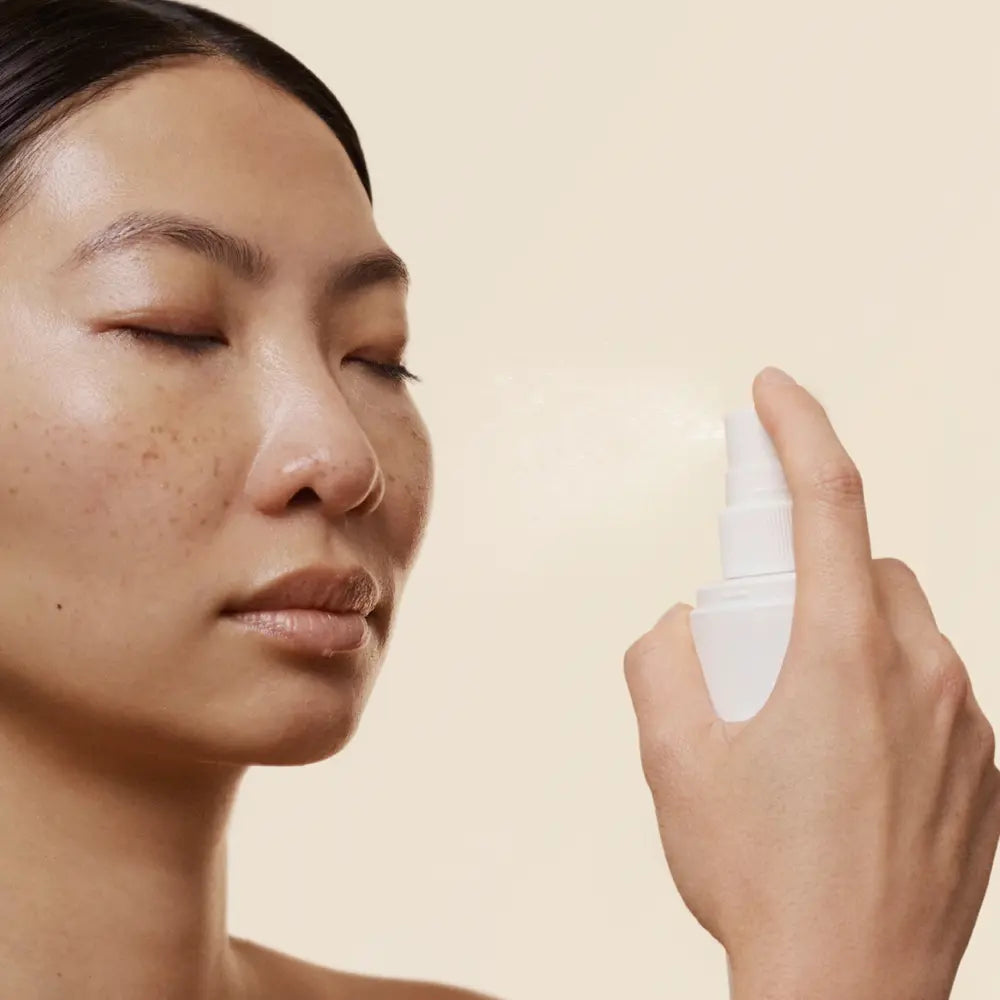 SkinMedica HA⁵ Hydra Collagen Facial Mist with Vegan Collagen mdel misting her face