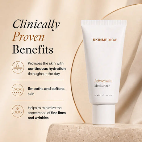 A white tube of  SkinMedica Rejuvenative Moisturizer stands on a stone pedestal against a warm beige background with elegant draped fabric and gold lines. Text on the left highlights clinically proven benefits for hydration, skin smoothness, and wrinkle minimization.