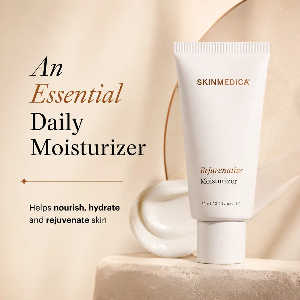 A white tube of  SkinMedica Rejuvenative Moisturizer standing on a stone pedestal, with promotional text on the left reading 'An Essential Daily Moisturizer' and smaller copy about nourishing, hydrating, and rejuvenating skin.