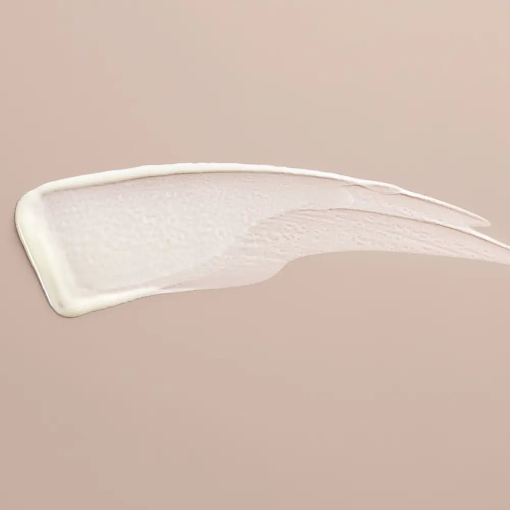 Close-up of TNS Eye Repair smear on a beige background