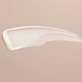 Close-up of TNS Eye Repair smear on a beige background