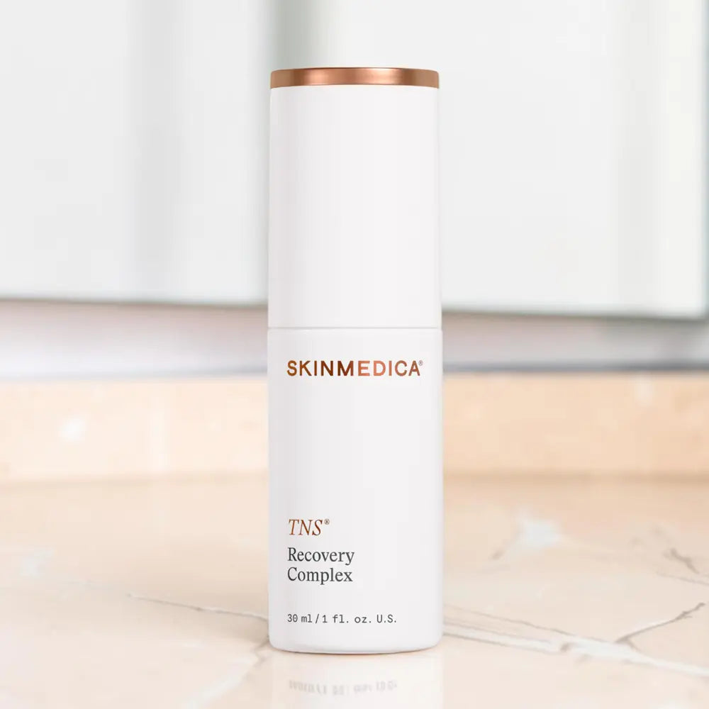 SkinMedica TNS Recovery Complex on a marble countertop