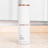 SkinMedica TNS Recovery Complex on a marble countertop
