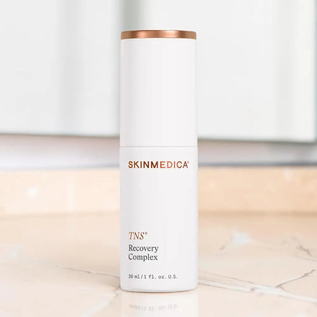 SkinMedica TNS Recovery Complex on a marble countertop