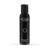 Black bottle of Truth Treatment Systems Hyaluronic Honey Cleanser 2 fl oz on a white background