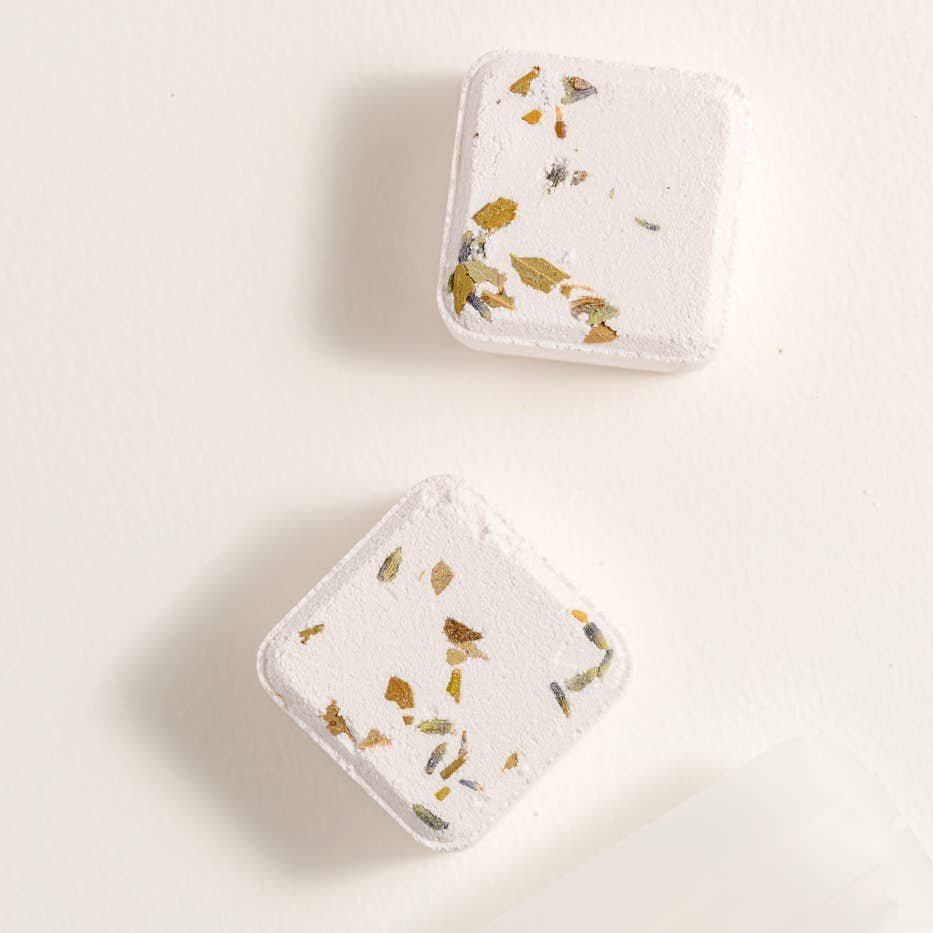 2 Mystic shower steamers in white background