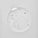 A droplet of Young Goose Bio-Barrier to show product texture centered on a solid light gray background.